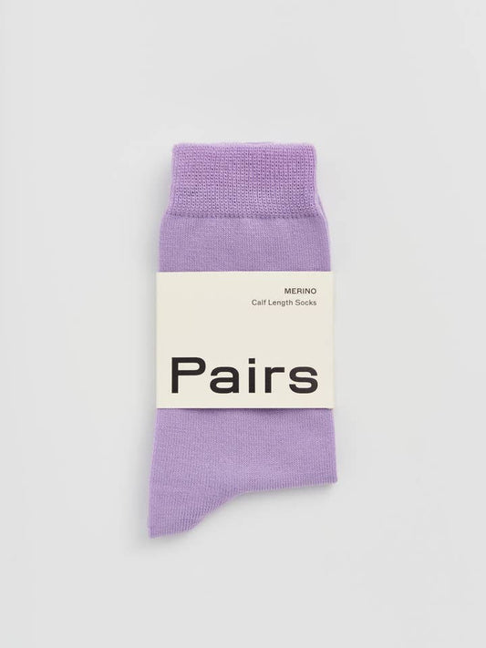 Purple sock with 'Pairs' label on a white background