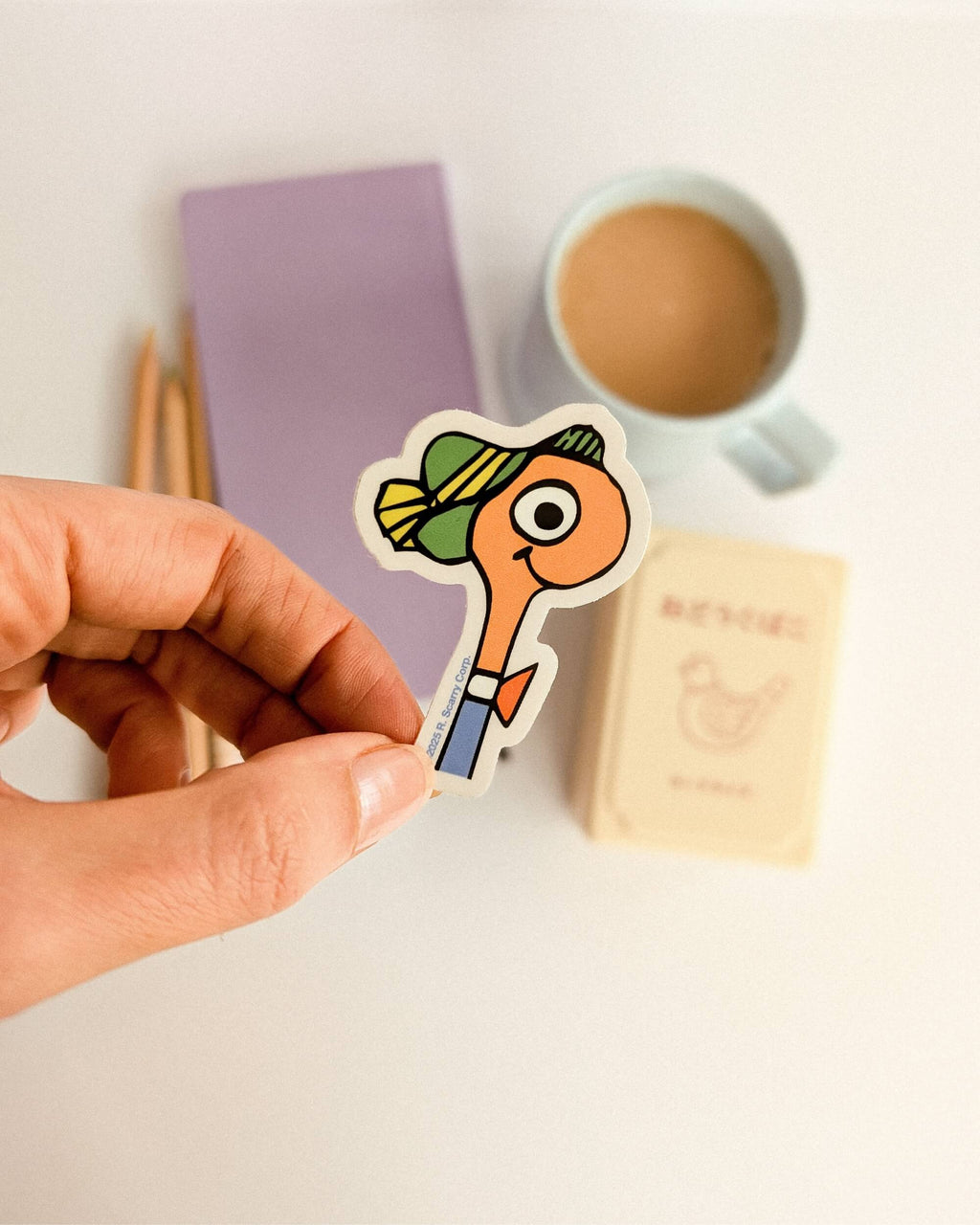 richard scarry lowly worm sticker held for size comparison