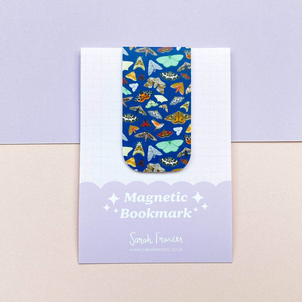 Magnetic bookmark with a moth pattern on a matching card, on a light purple background