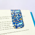Moth magnetic bookmark with navy blue background and illustrated moths