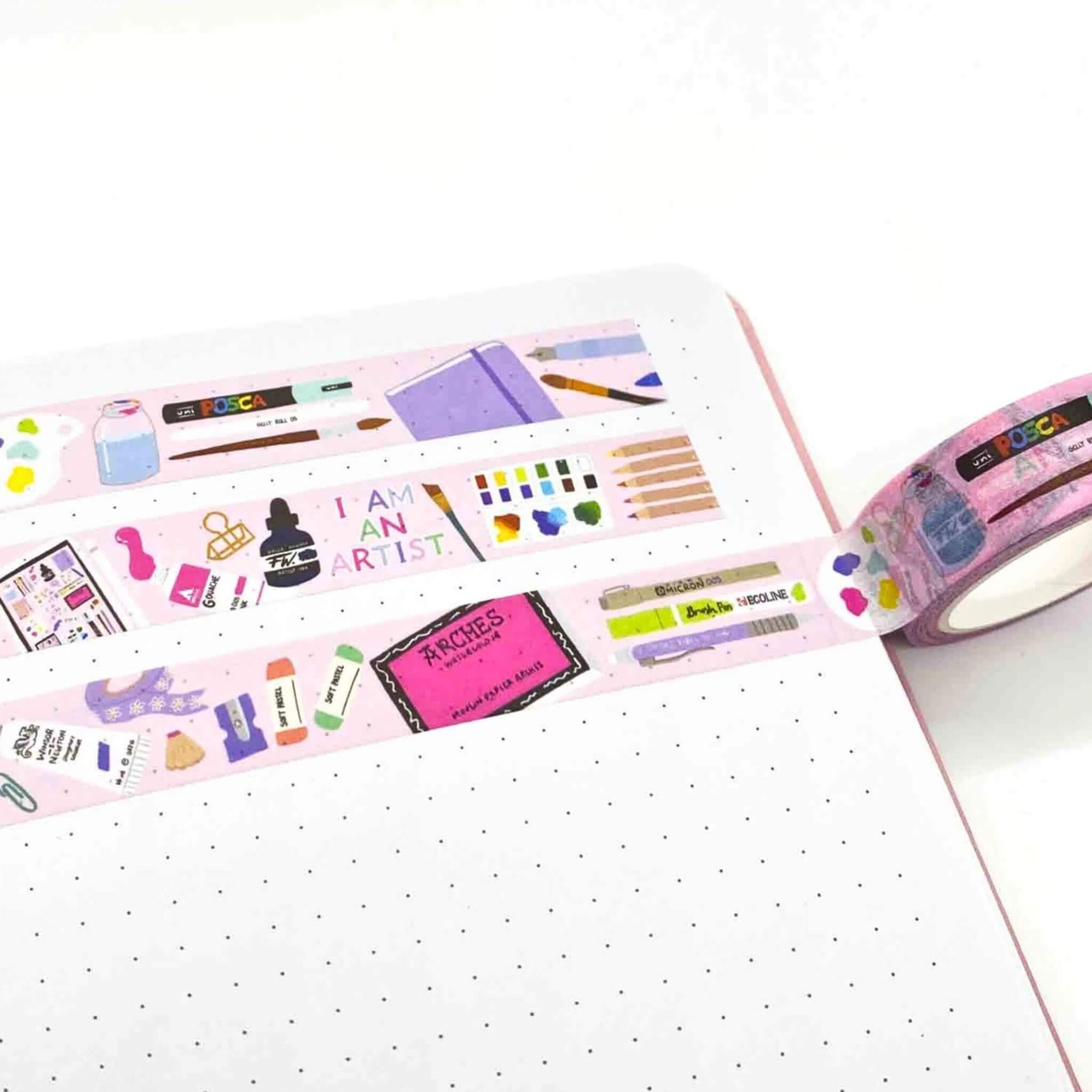 Pink washi tape with artistic designs on a white surface