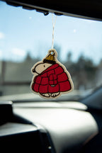 Snoopy car air freshener featuring Puffy Coat design in car window