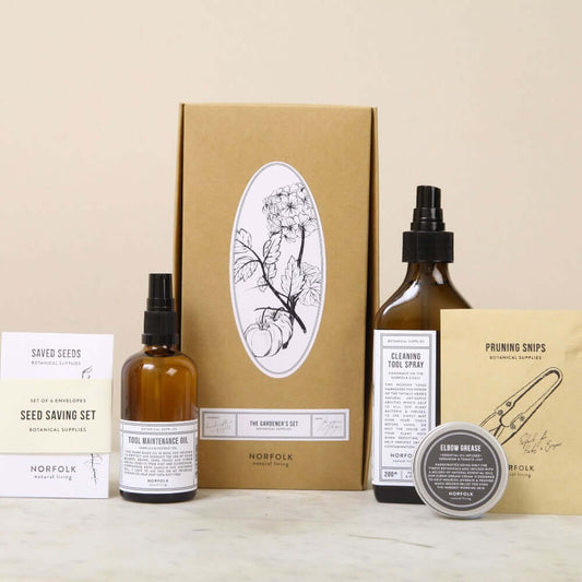 Collection of gardening products including bottles, a box, and a container on a beige background