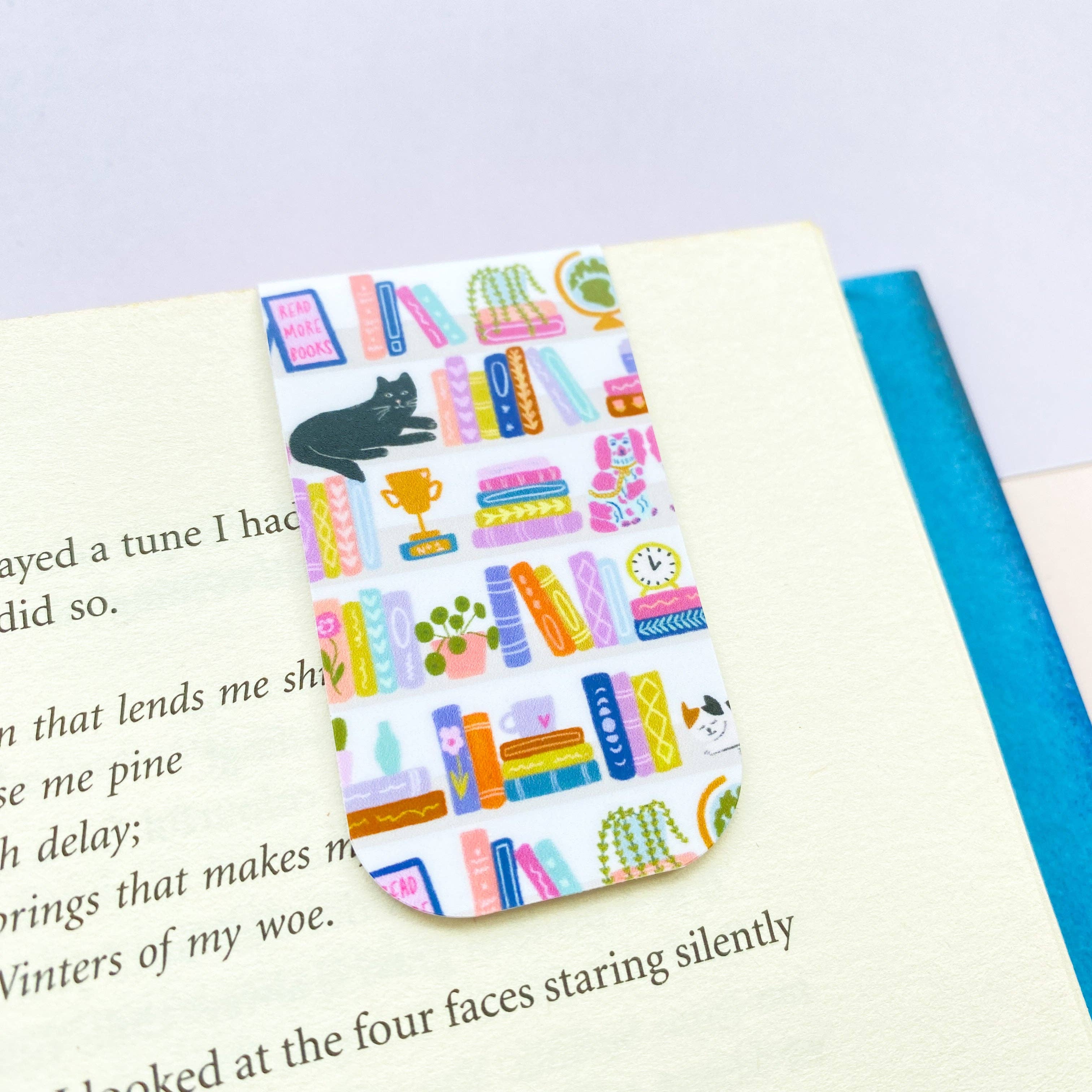 Bookshelf magnetic bookmark with illustrated book pattern on white background