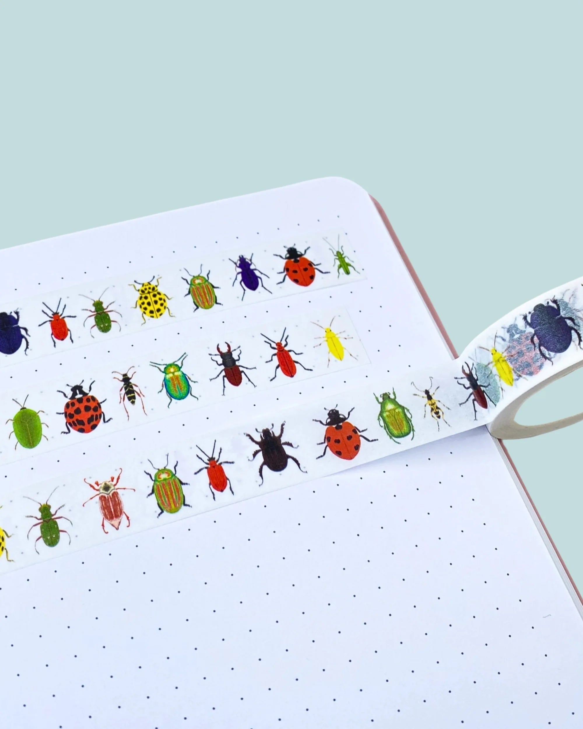 colourful beetle washi tape design on a white notebook page