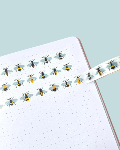 washi tape design with british bees stuck on notebook paper