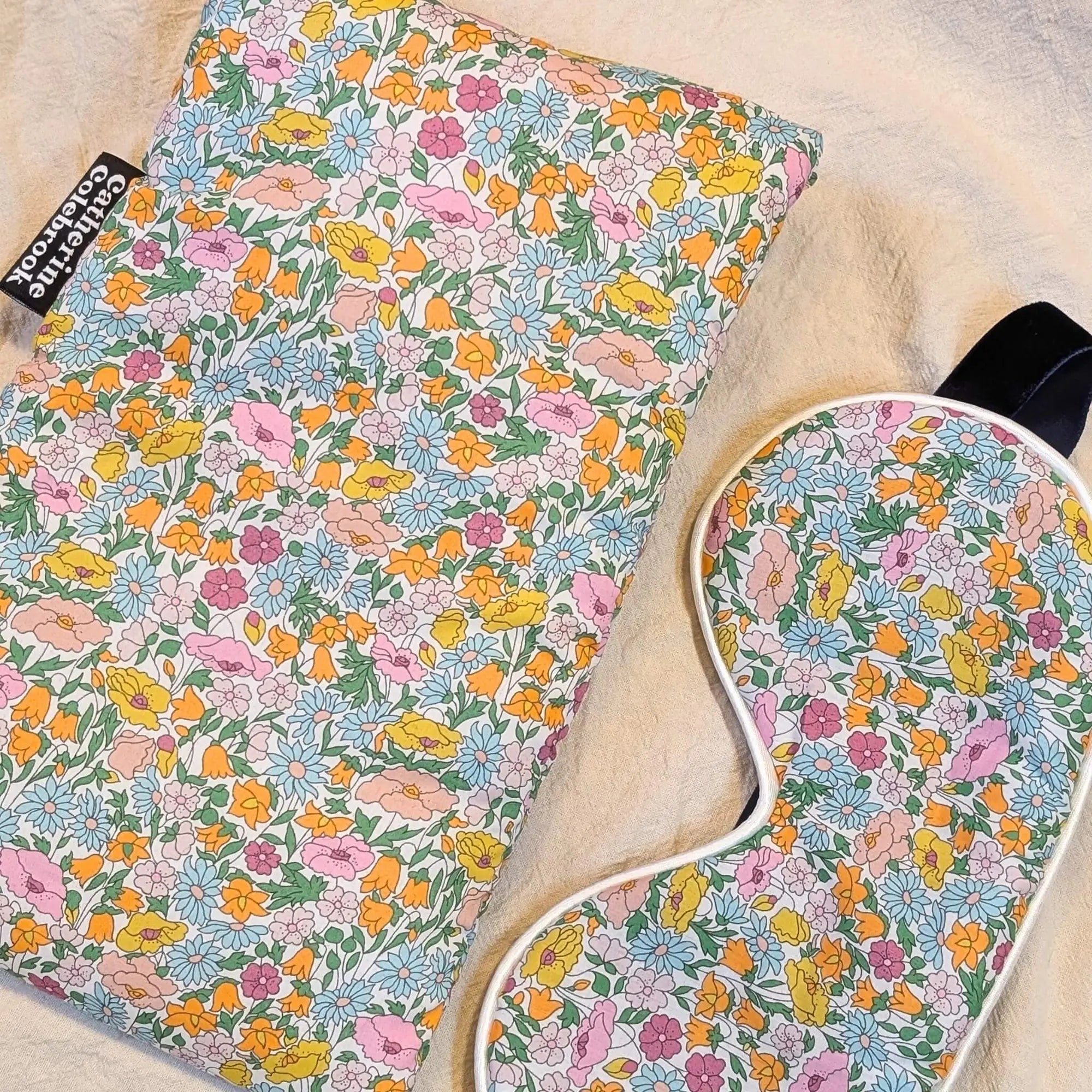 Floral-patterned eye mask and hot water bottle