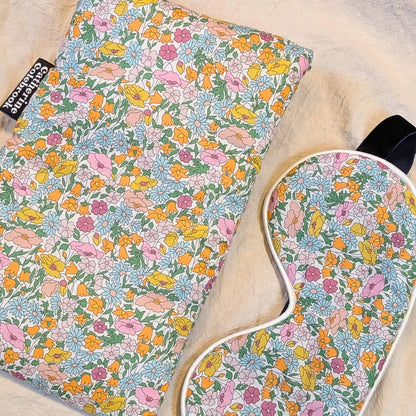 Floral-patterned eye mask and hot water bottle