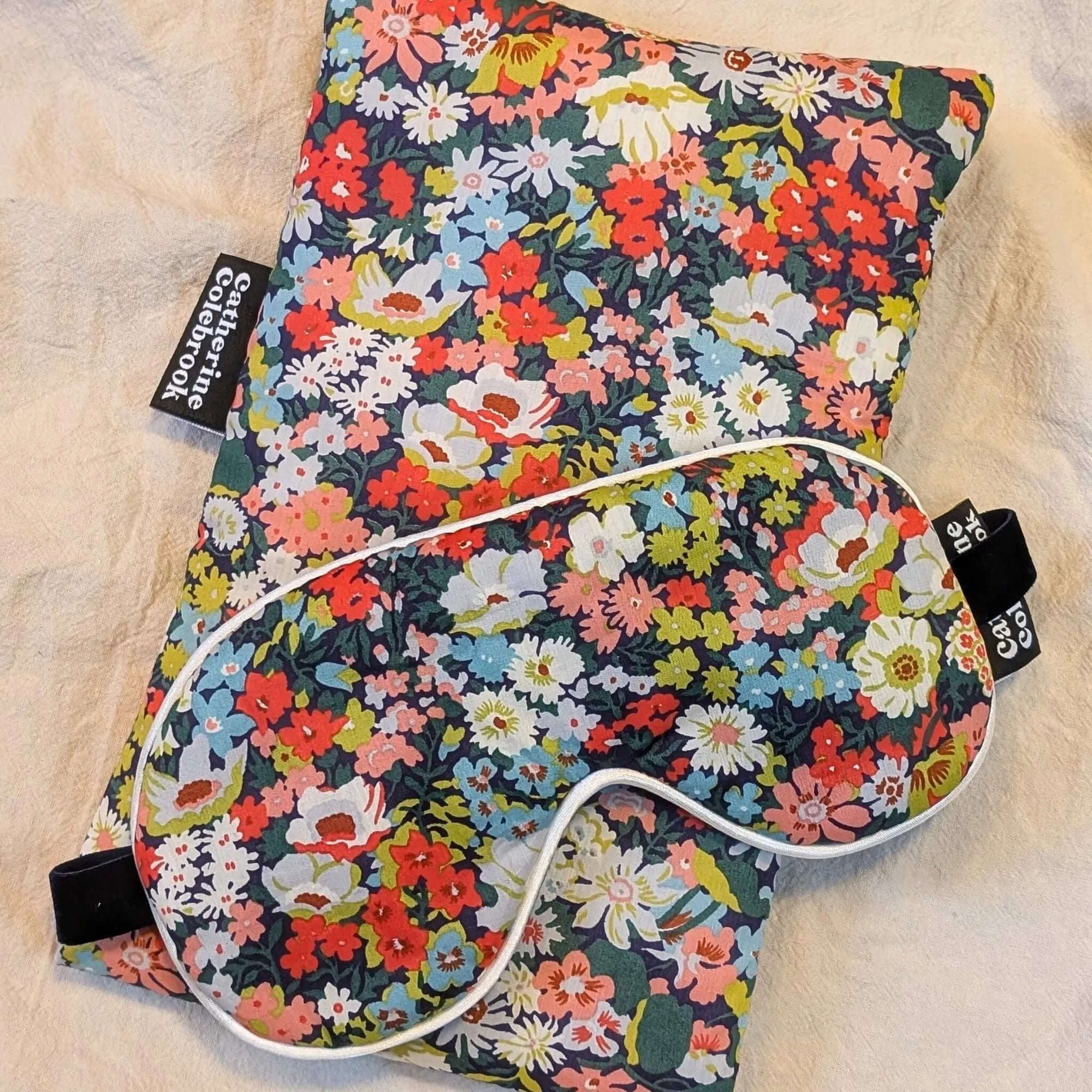 Floral-patterned mini hot water bottle and eye mask