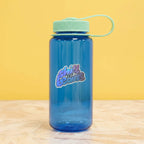 Clarice Tudor Chill Thy Beans holographic vinyl sticker on water bottle