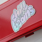 Clarice Tudor Chill Thy Beans holographic vinyl sticker on red tin