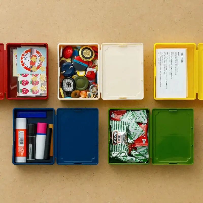 Small retro toolbox storing stationery items on desk