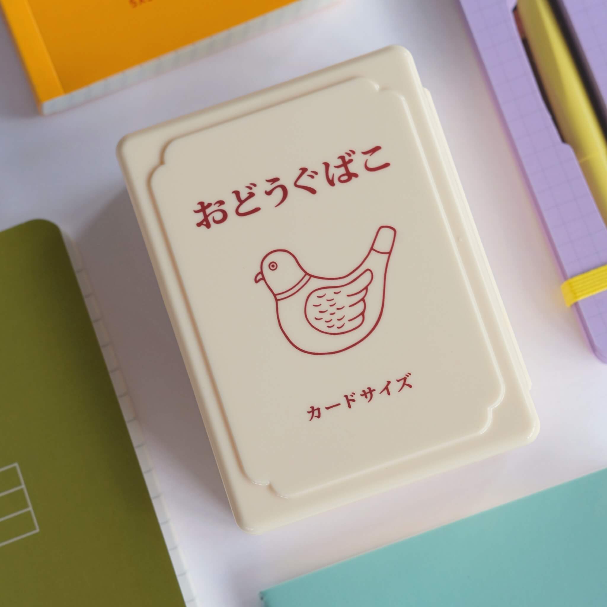 Small retro metal toolbox storing stationery items on desk