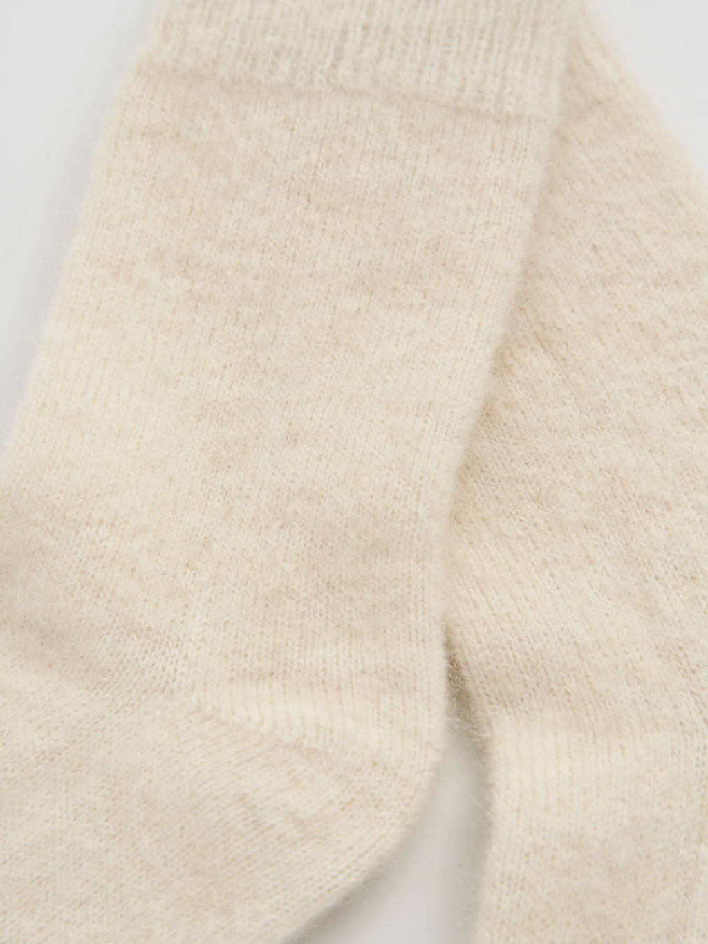close up of cream alpaca socks 