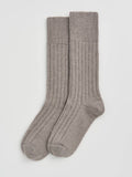 Pair of gray socks on a light gray background
