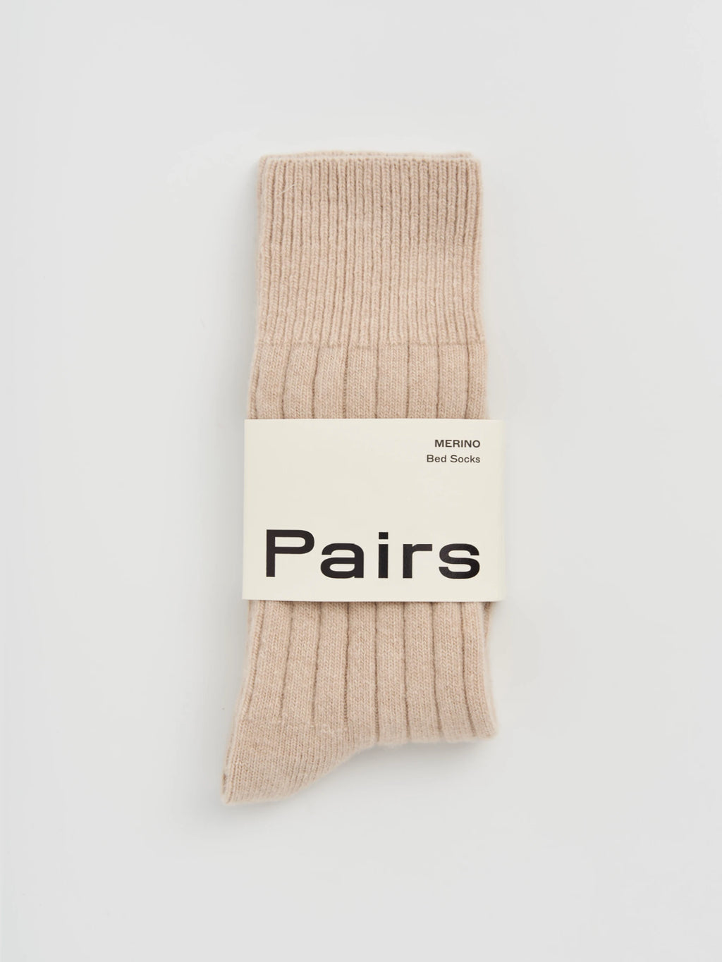 Beige sock with 'Pairs' label on a light gray background