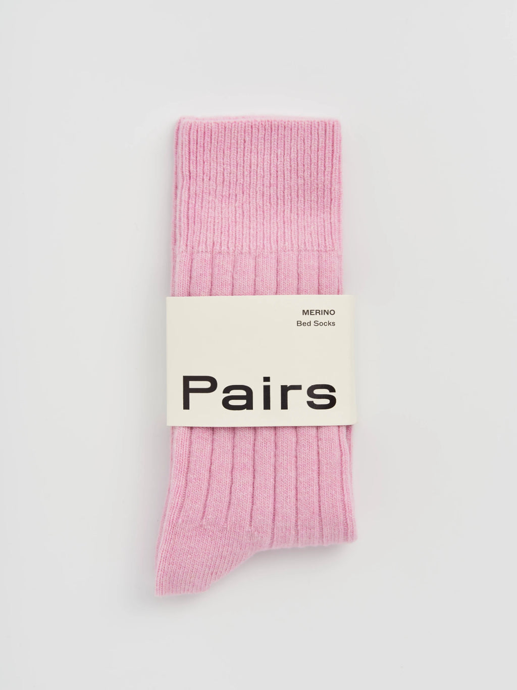 Pink socks with a 'Pairs' label on a light gray background
