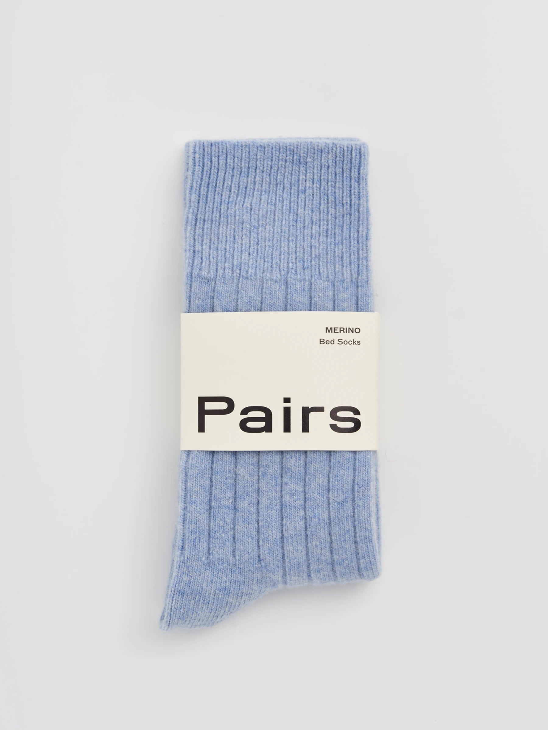 Light blue socks with a 'Pairs' label on a light gray background