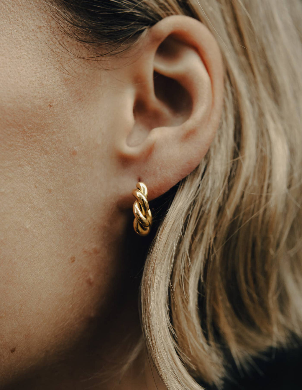 twisted gold hoop earrings in stainless steel