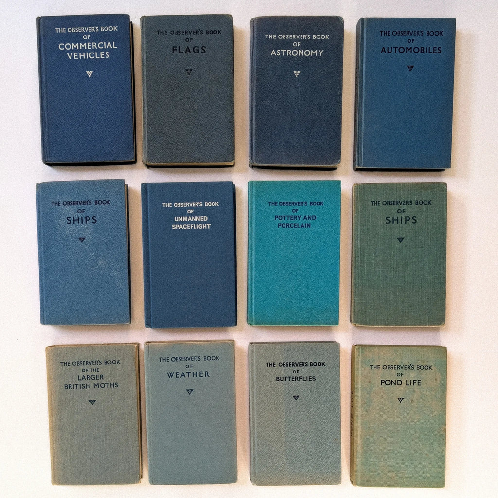 Collection of vintage books titled 'Commercial Vehicles', 'Flags', 'Astronomy', 'Automobiles', 'Ships', 'Unmanned Spaceflight', 'Pottery and Porcelain', 'Larger British Moths', 'Weather', 'Butterflies', and 'Pond Life' on a white background.