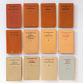 Collection of vintage books with titles on a white background