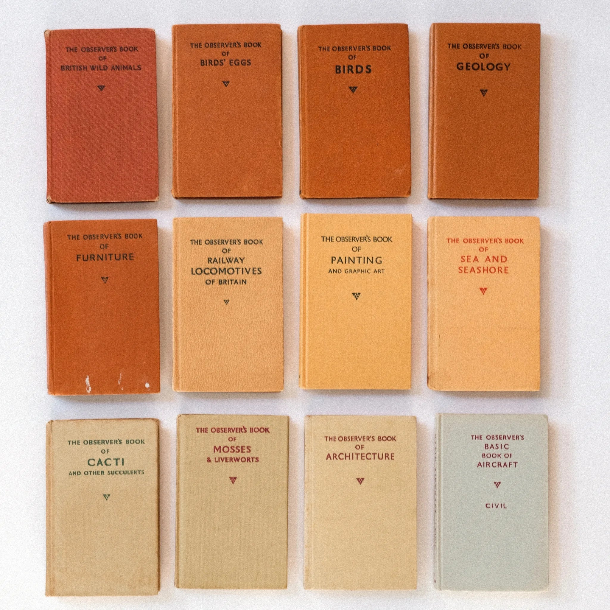 Collection of vintage books with titles on a white background