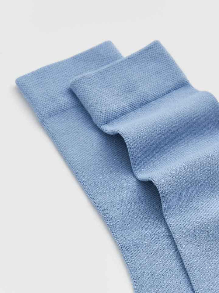Light blue knitted fabric on a light gray background