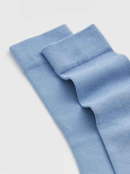 Light blue knitted fabric on a light gray background