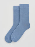 Pair of light blue socks on a white background