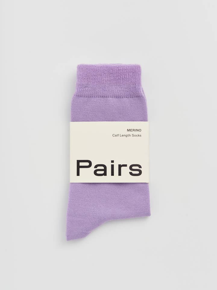 Purple sock with 'Pairs' label on a white background