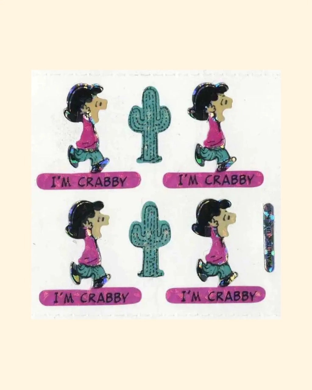 Sticker set with lucy from peanuts character and cactus, labeled 'I'm Crabby', on a beige background.