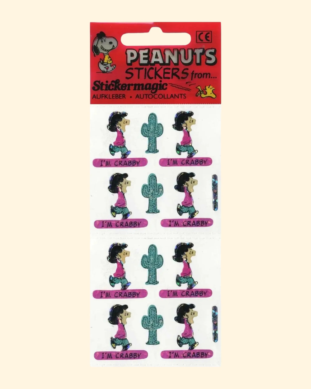 Peanuts-themed stickers with a character and cacti on a red and beige backing.