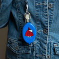 blue snoopy keyring attached to denim jacket