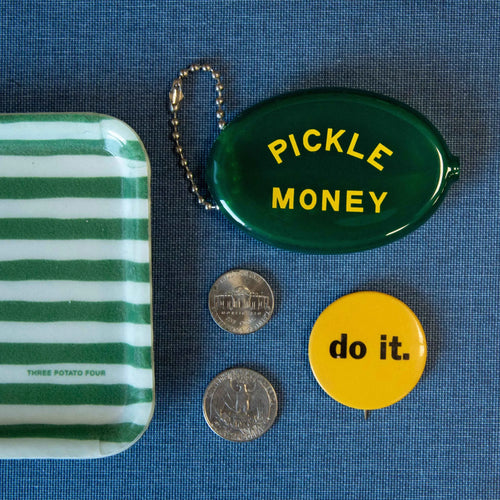 Green and white striped tray, 'Pickle Money' coin pouch, and 'do it.' button on a blue background