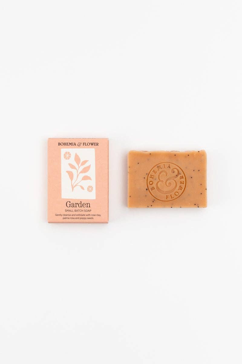 Handmade pink clay soap bar with rose petals and poppy seed exfoliation