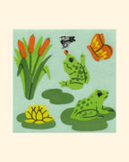 Set of frog-themed stickers on a light green background