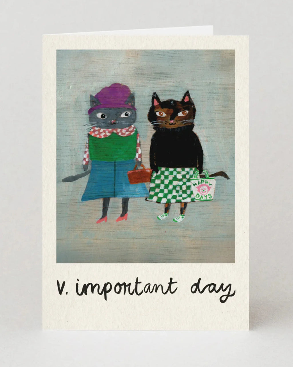 Greeting card with two cats in costumes and the text 'v. important day' on a light gray background.